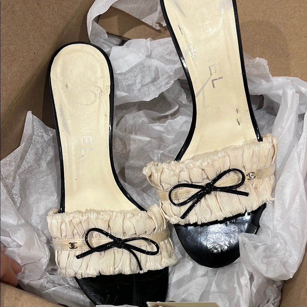 CHANEL Black and Cream Mules with Bow Detail